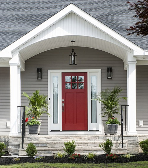 A red door on a suburban residential home